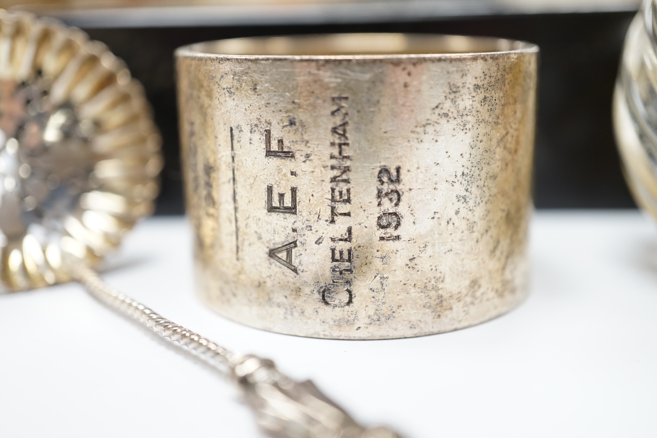 Four assorted silver mounted glass toilet jars, an Edwardian silver mounted glass mustard jar with spoon, a silver napkin ring, sifter spoon and ebony box. Condition - poor to fair